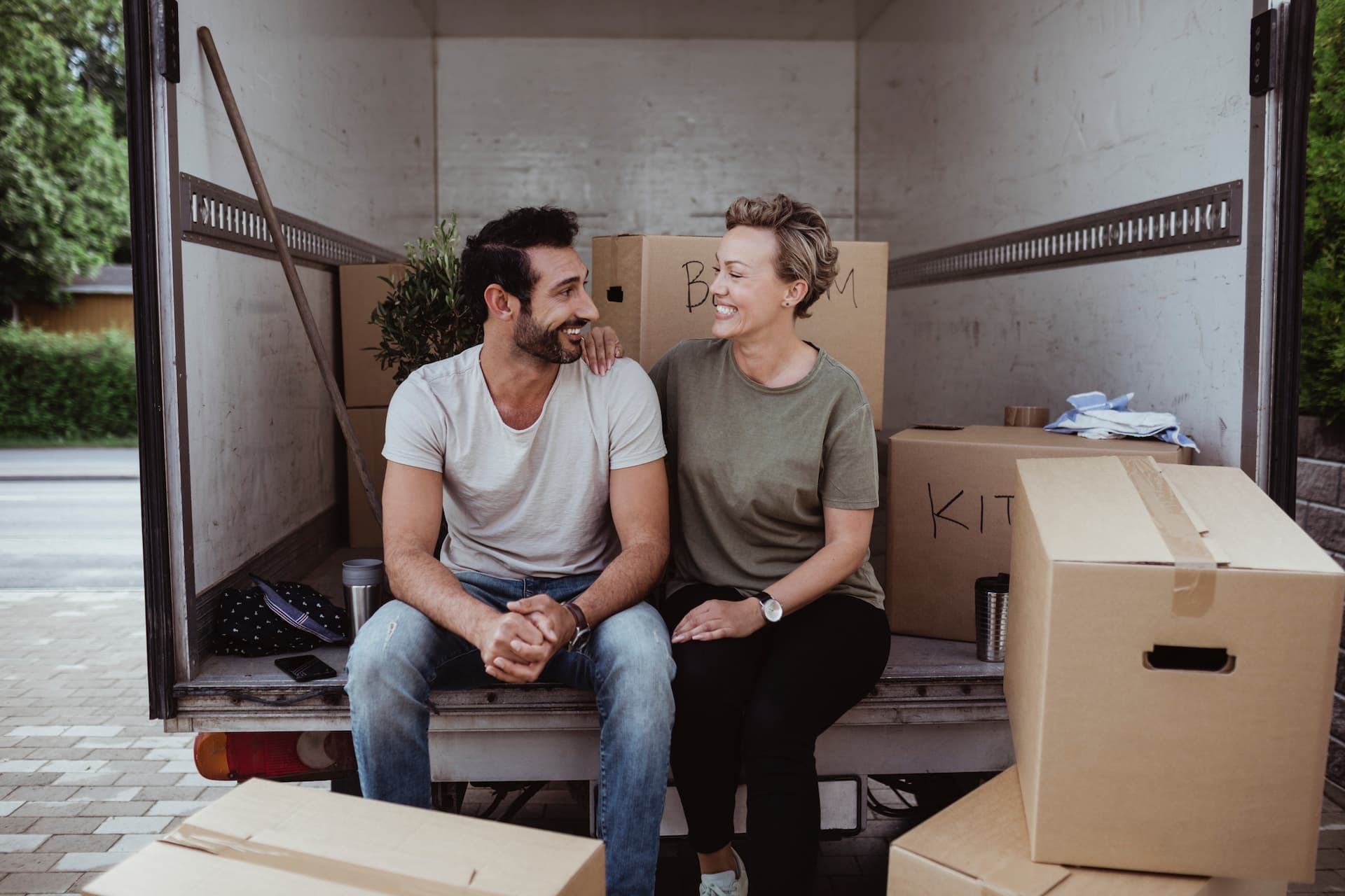 Couple sitting in moving van